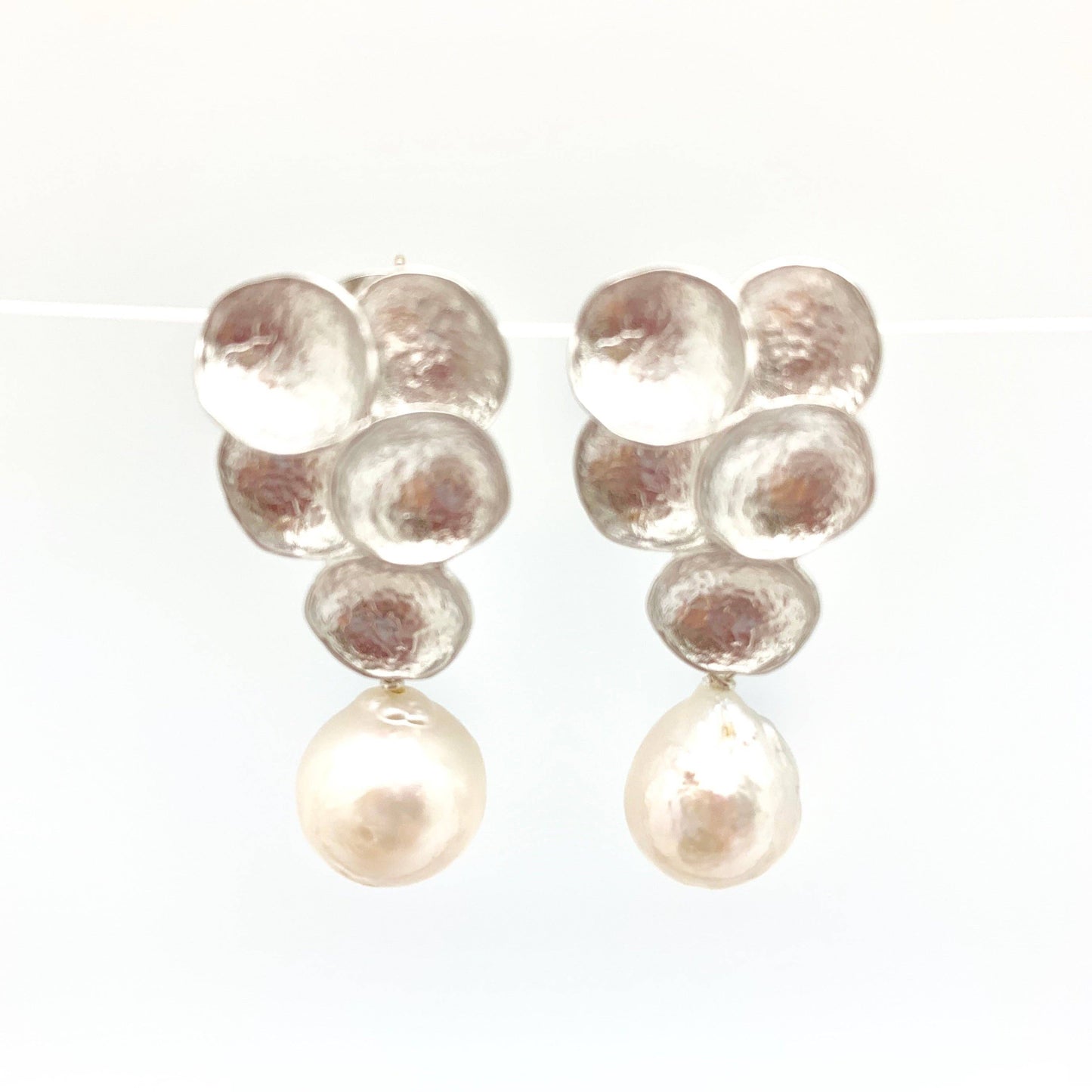 Beautifully crafted silver earrings with stunning Baroque pearls.