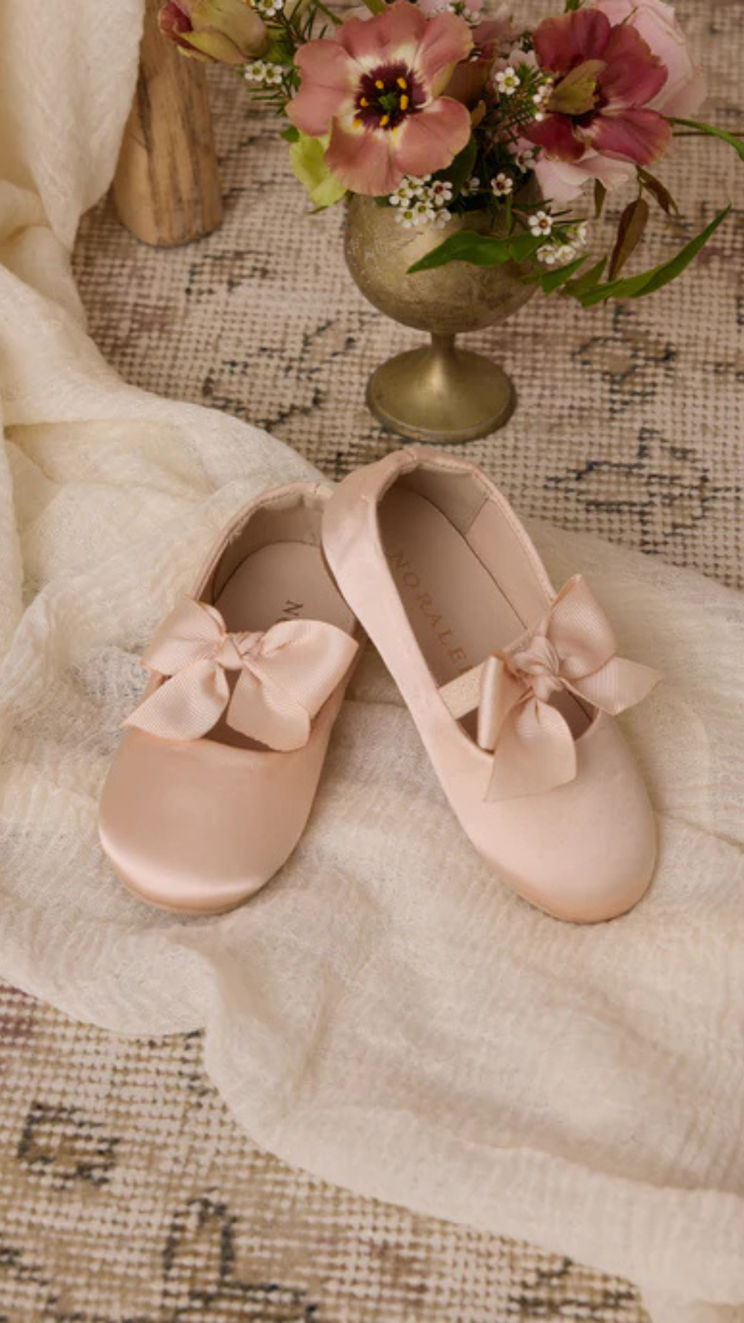 Elevate your little one’s wardrobe with the timeless elegance of the Bow Ballet Flat in Antique by Noralee.