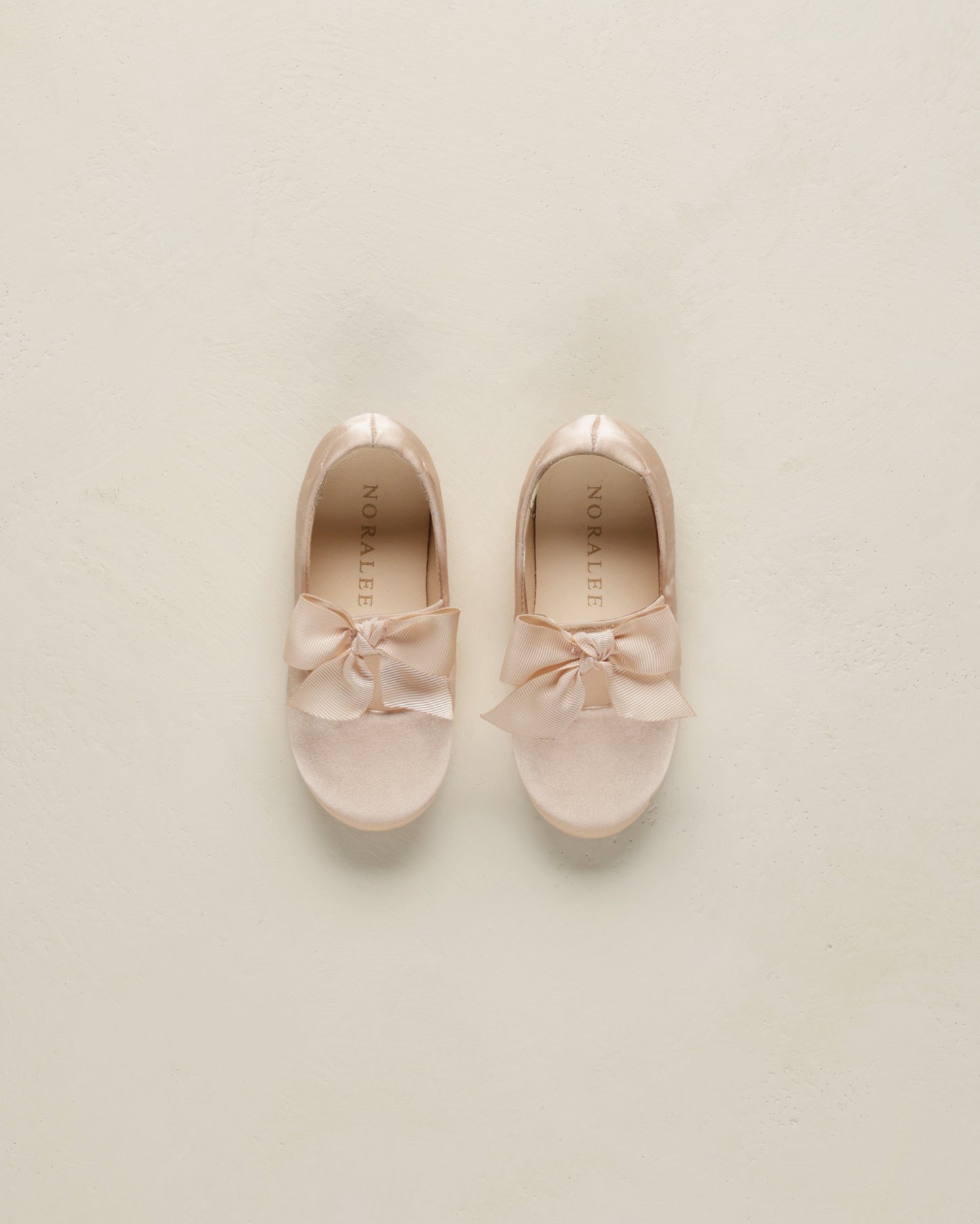 The delicate bow on the toe adds a playful yet sophisticated touch, making them perfect for both everyday wear and special outings.