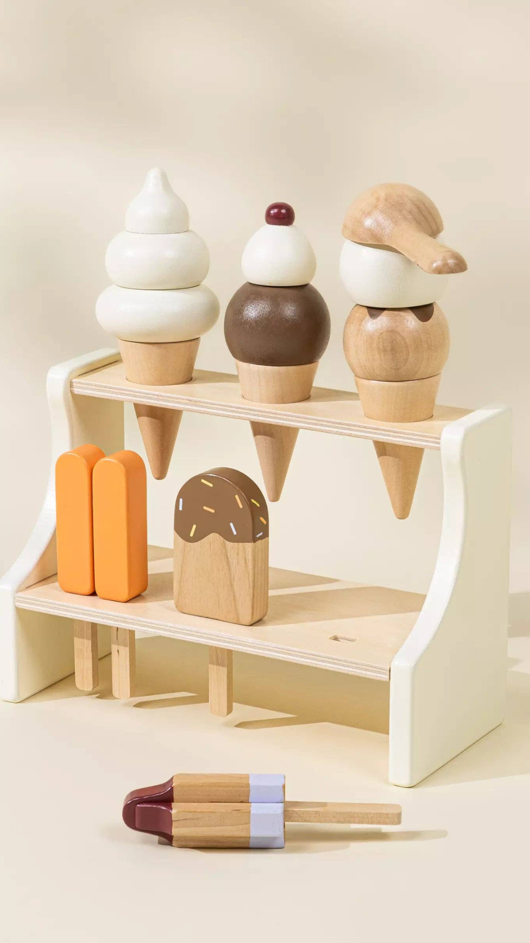 Different angle of Wooden Ice Cream Stand with a bombpop ice pop displayed alongside, highlighting the fun, colorful accessories that make this playset perfect for kids to serve up imaginative desserts.