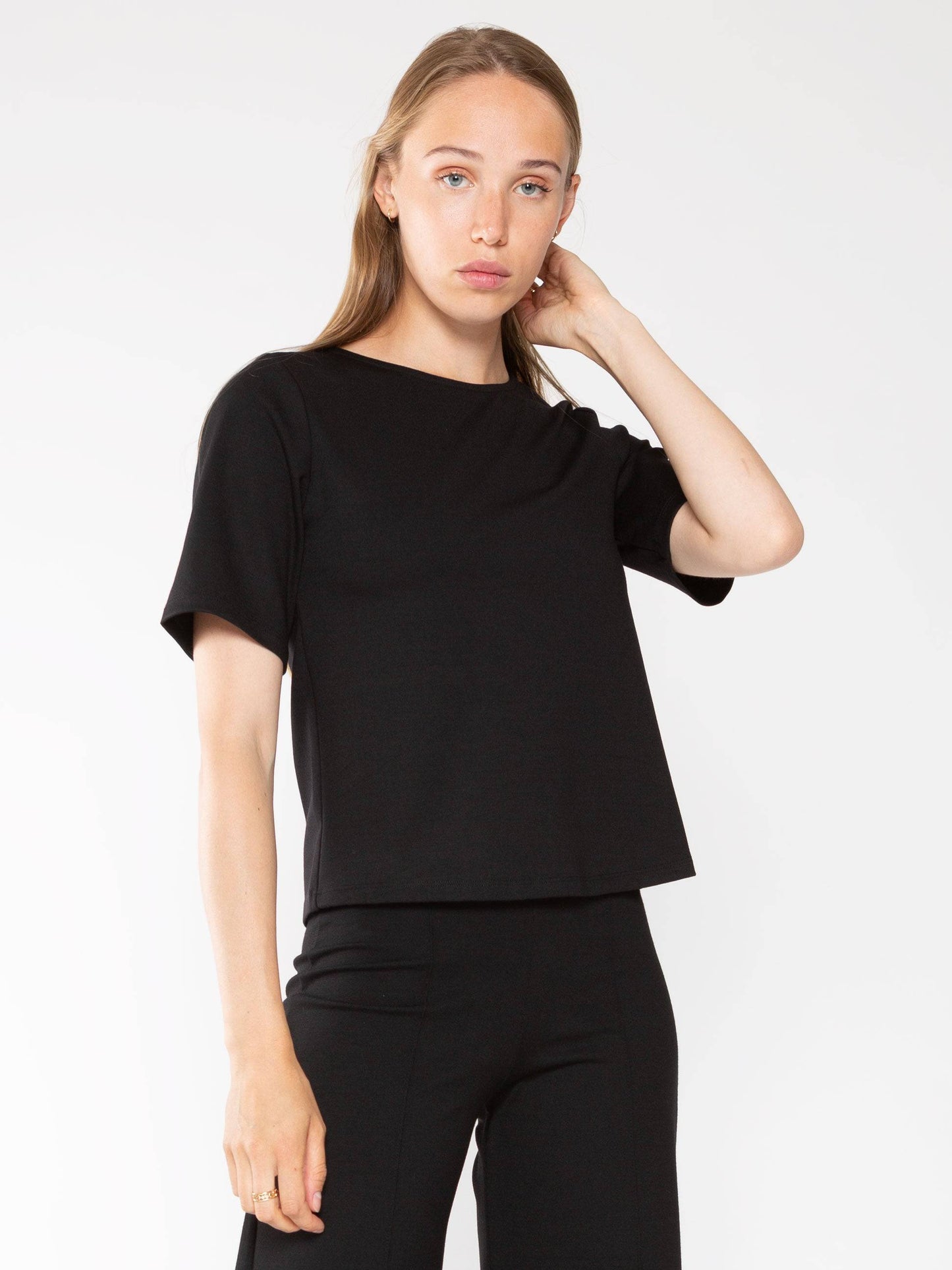 Elevate your everyday style with the Ponte Knit Short Sleeve Top in Black by Ripley Rader.