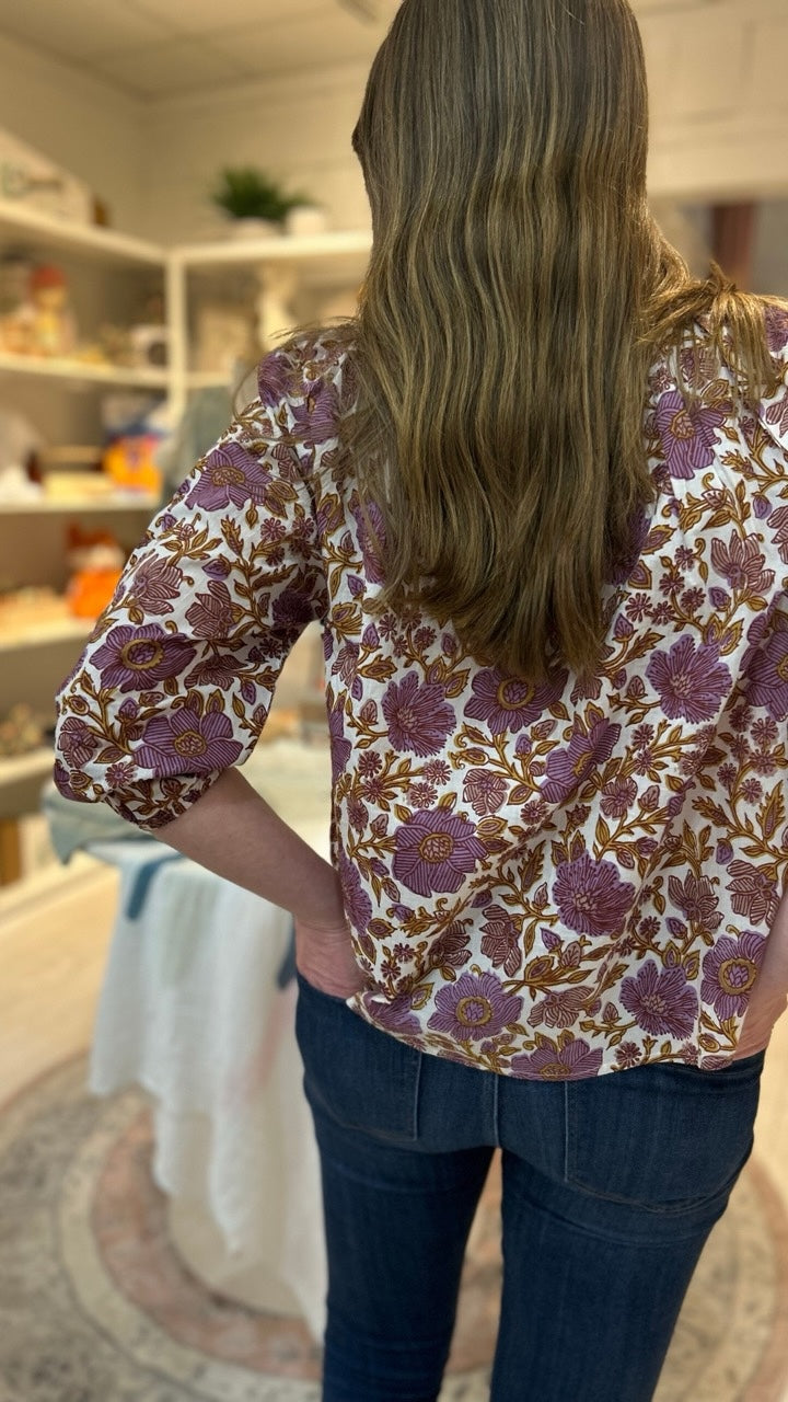 Close-up back view of the Sophie Top in Lilac Orsay Floral by Marea, highlighting the intricate ruffle detail and delicate hand-blocked print.