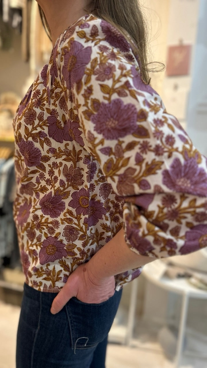 Side view of the Sophie Top in Lilac Orsay Floral by Marea, emphasizing its relaxed fit and feminine silhouette, perfect for any spring occasion.