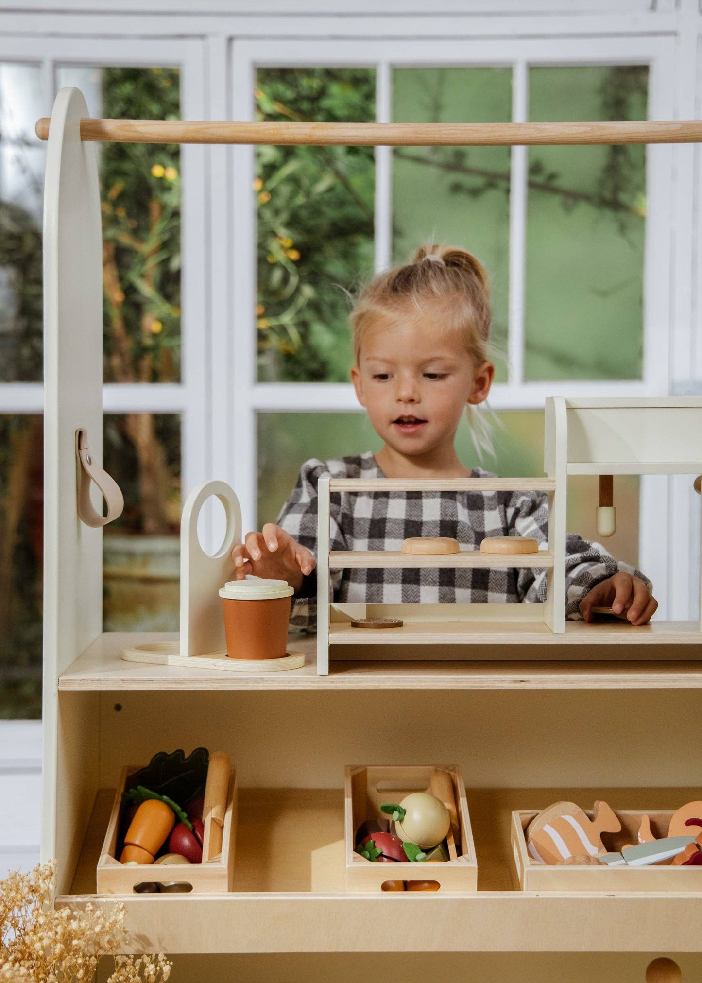 Playset in a cozy room setting, highlighting scale and interaction for toddlers