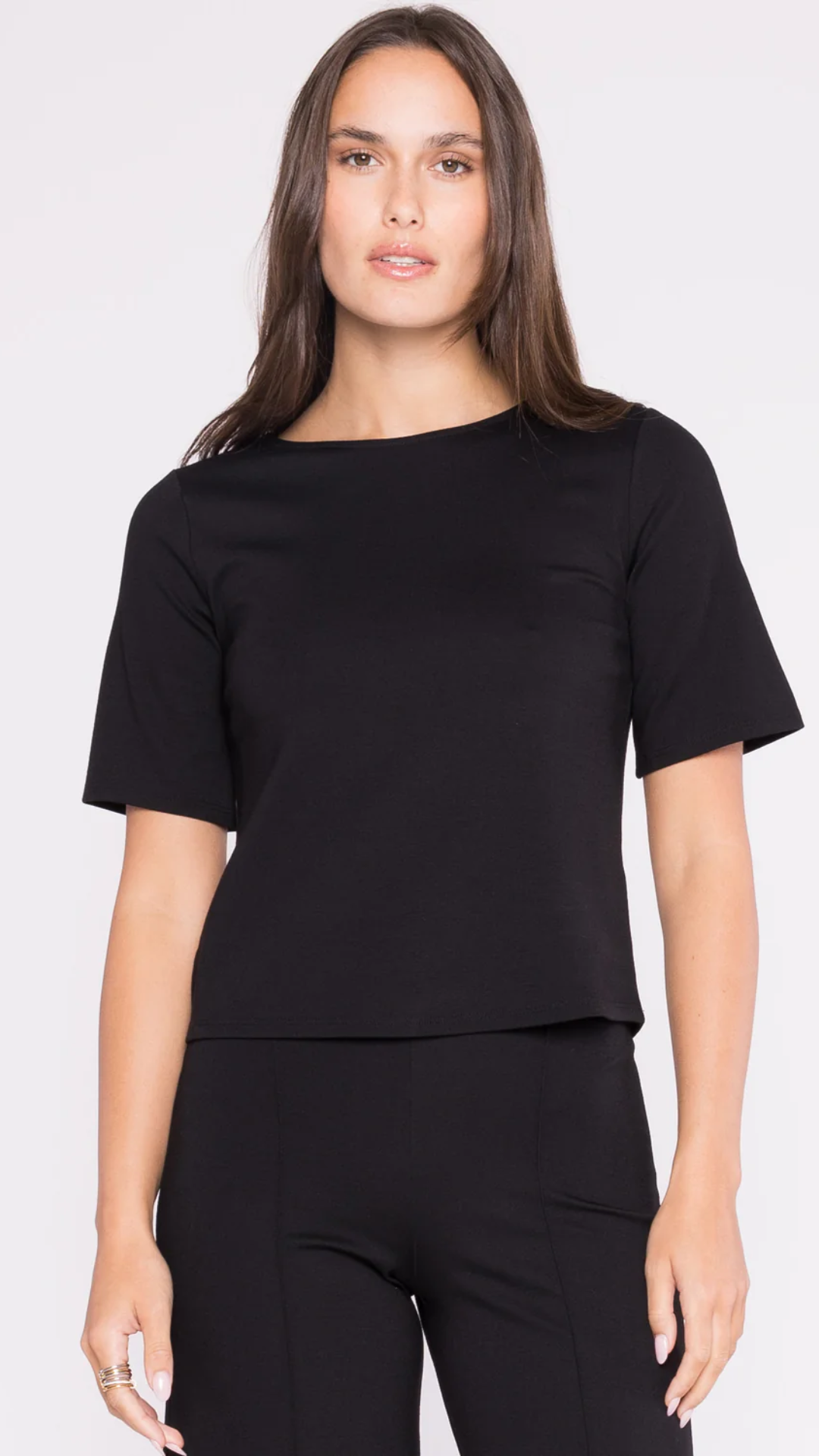 Model wearing the Ripley Rader Black Ponte Knit Short Sleeve Top, highlighting its USA-made quality, tailored fit, and modern short sleeves for effortless style.