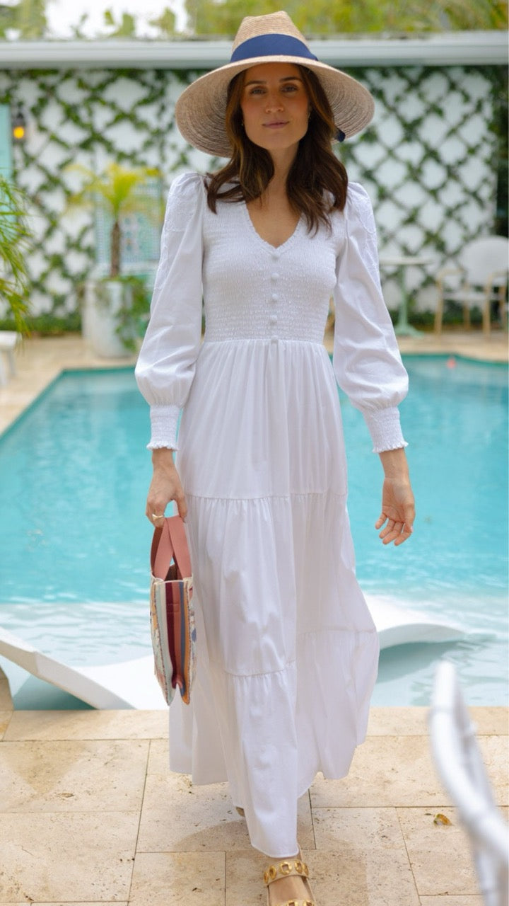 Woman in the Blanche Dress standing poolside in the sun