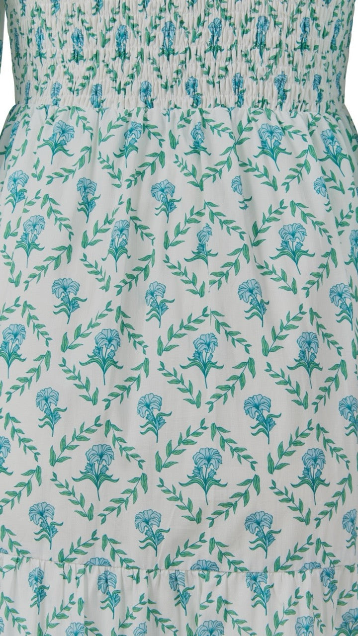 Close-up of the trellis print on the Bridgette Dress, highlighting the fabric texture and vibrant blue-and-white pattern.