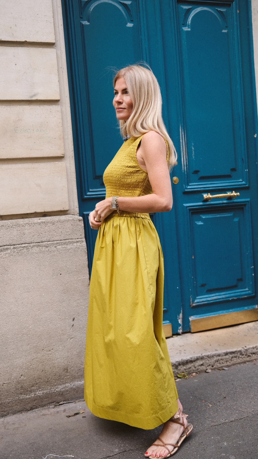 A feminine and timeless look with the Charlotte Smocked Top, worn by Liz Joy in Paris for a sophisticated street-style moment.