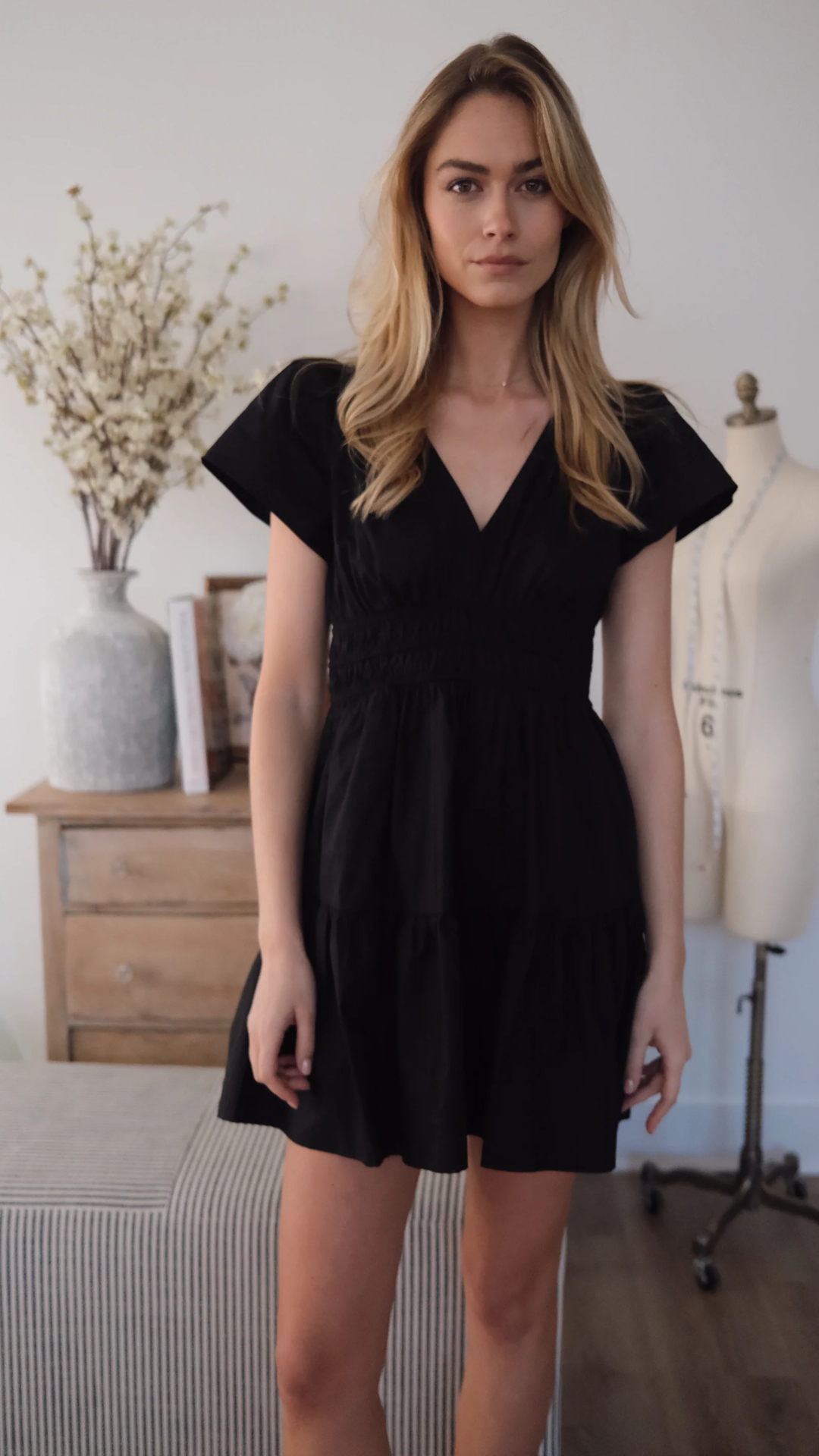 Studio model wearing the Anna Mini Dress with an effortless day-to-night styling approach.