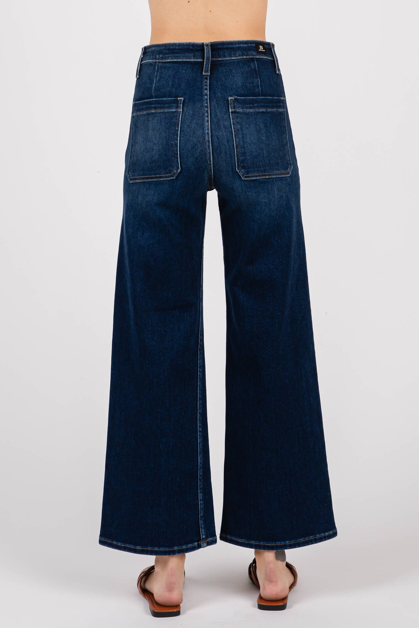 Back view of Dark Sailor Jeans in rich dark wash showing back pocket placement and cropped wide leg silhouette.