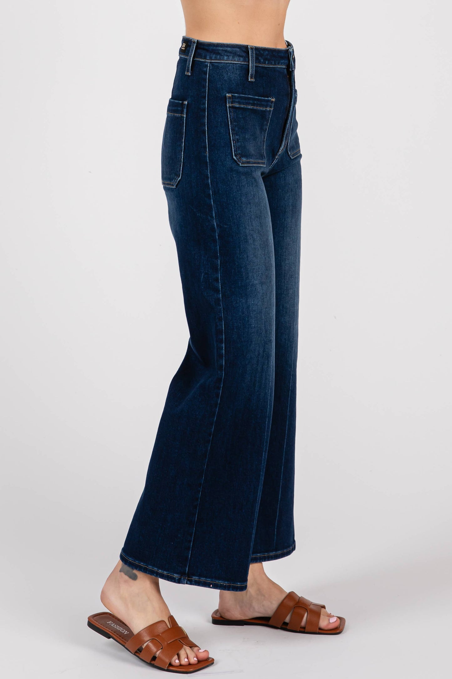 Side view of cropped high rise sailor jeans showing clean lines, cropped flare leg, and flattering fit through the hip and thigh.