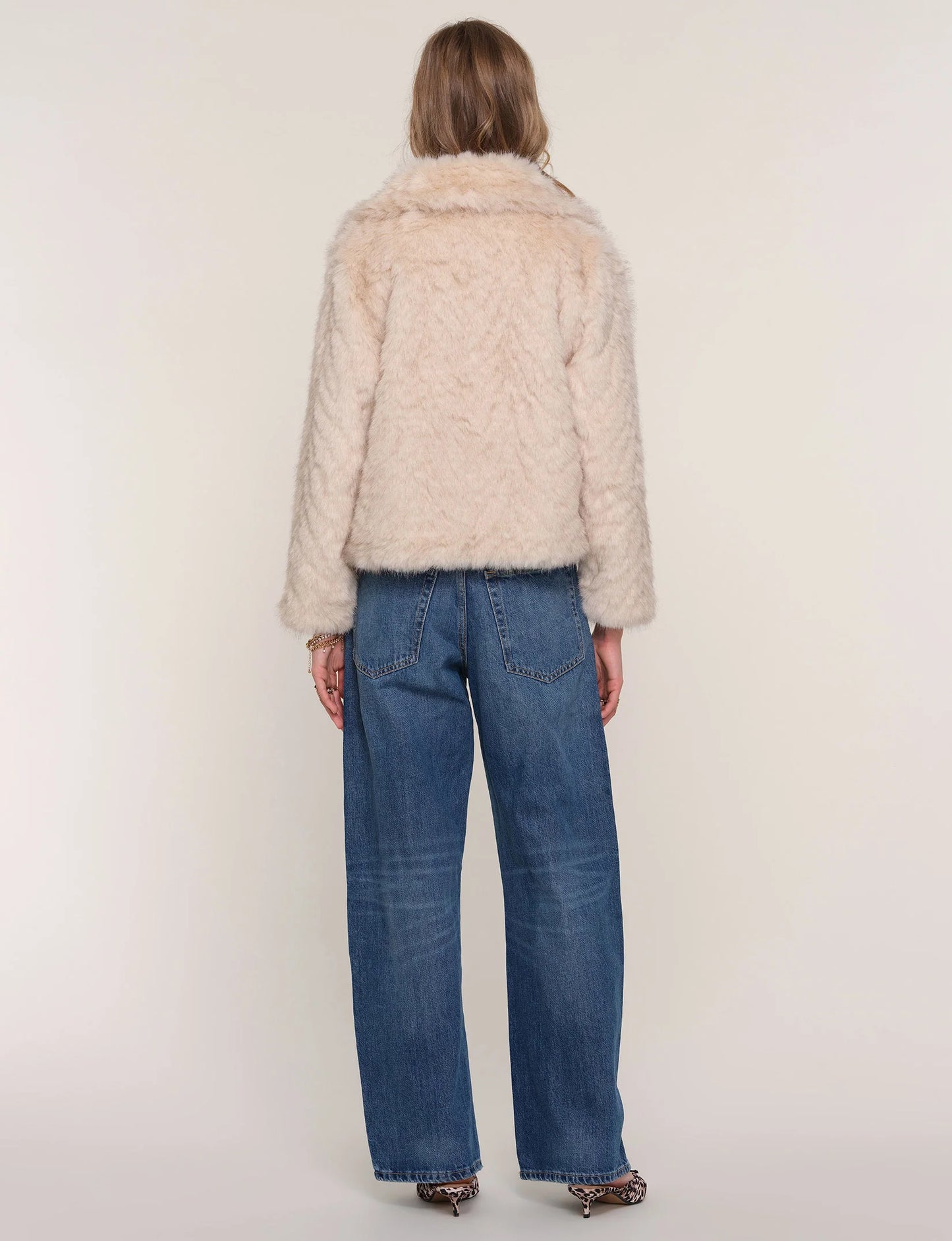 Back view of Elsbeth Faux Fur Jacket on model, showing plush faux fur texture and complete coverage.