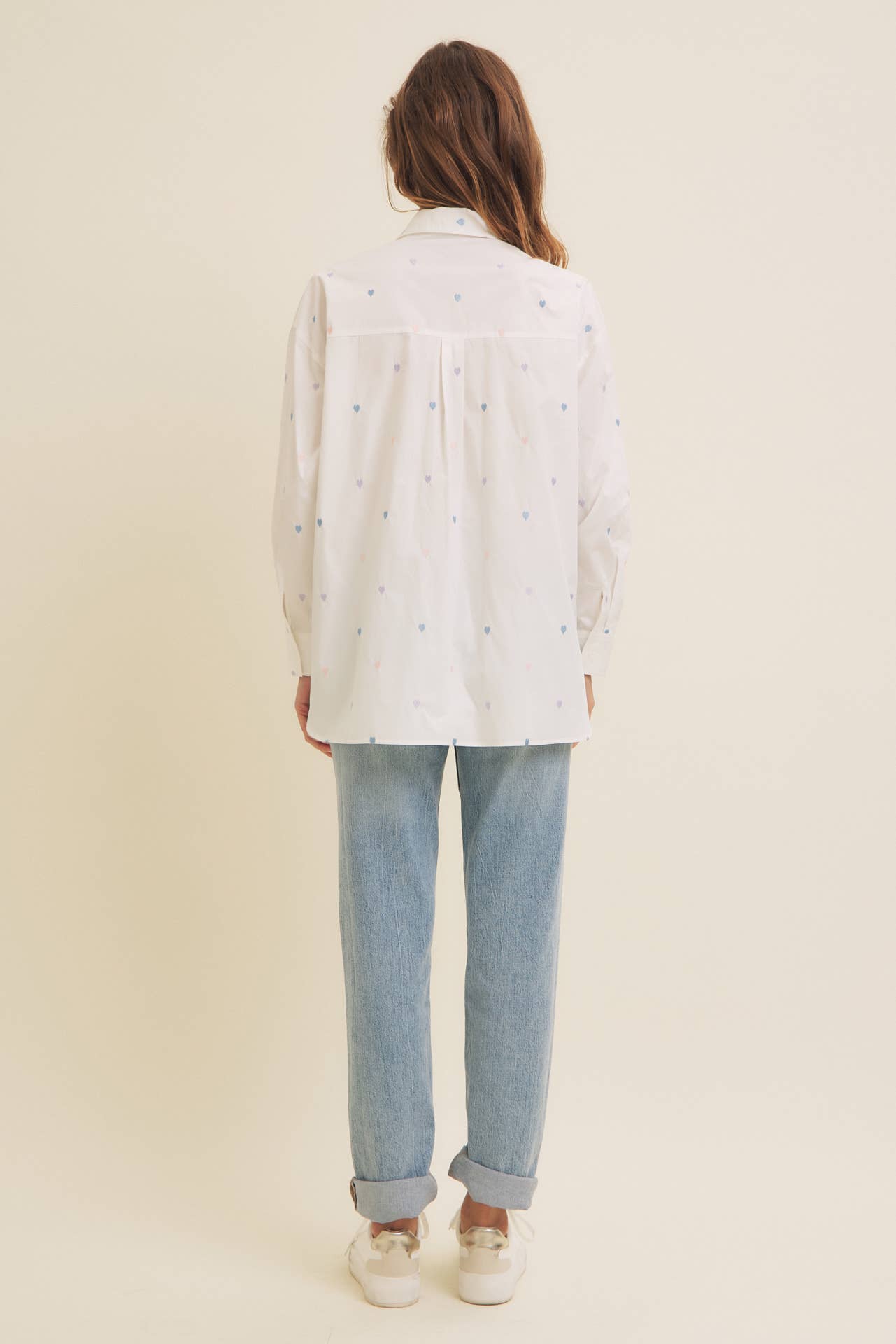 Back view of Full of Hearts Shirt showing split hem, long sleeves, and comfortable cotton construction