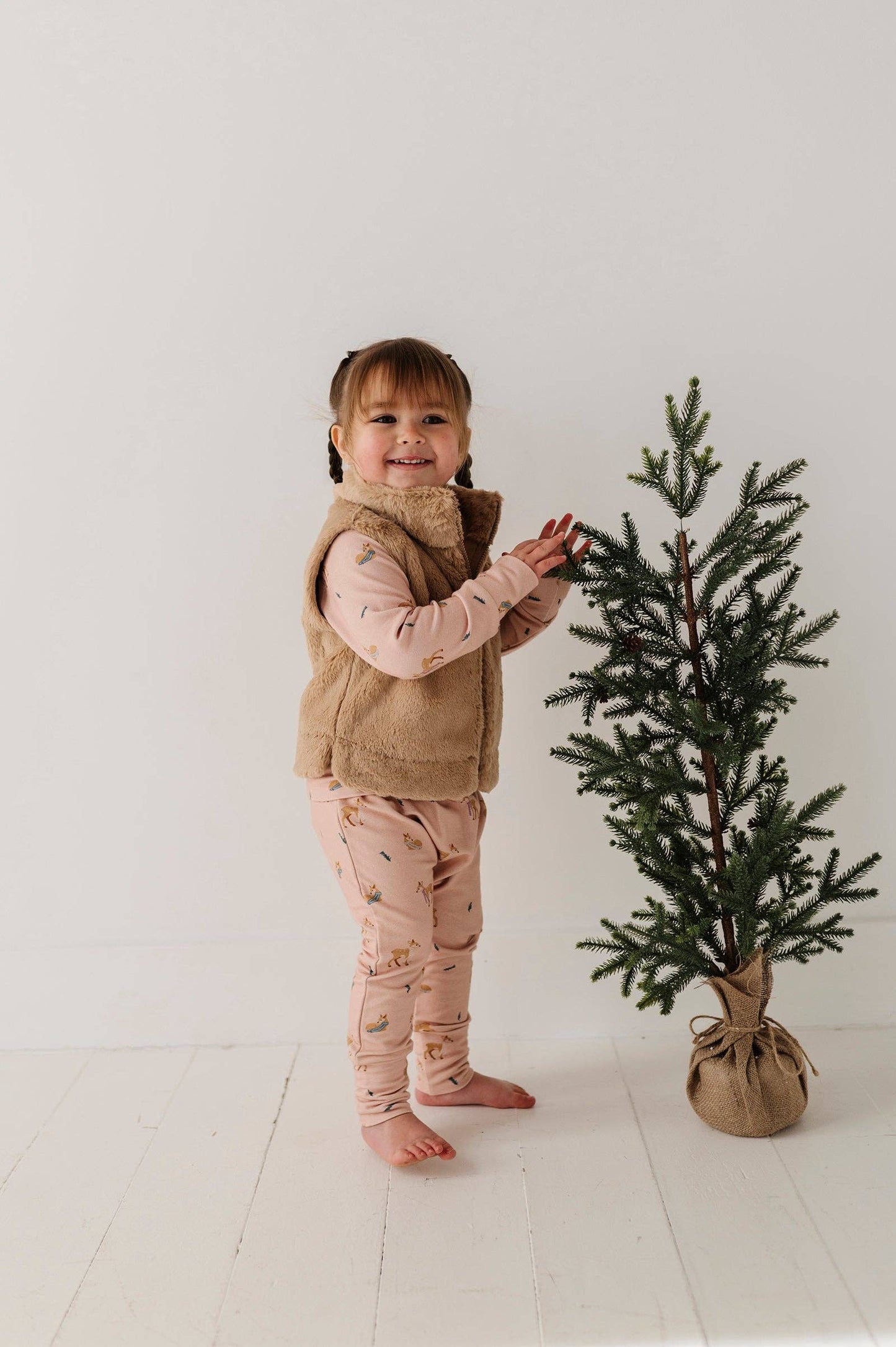 Back view of ultra-soft faux fur vest on child, perfect for winter layering and stylish kids’ fashion.