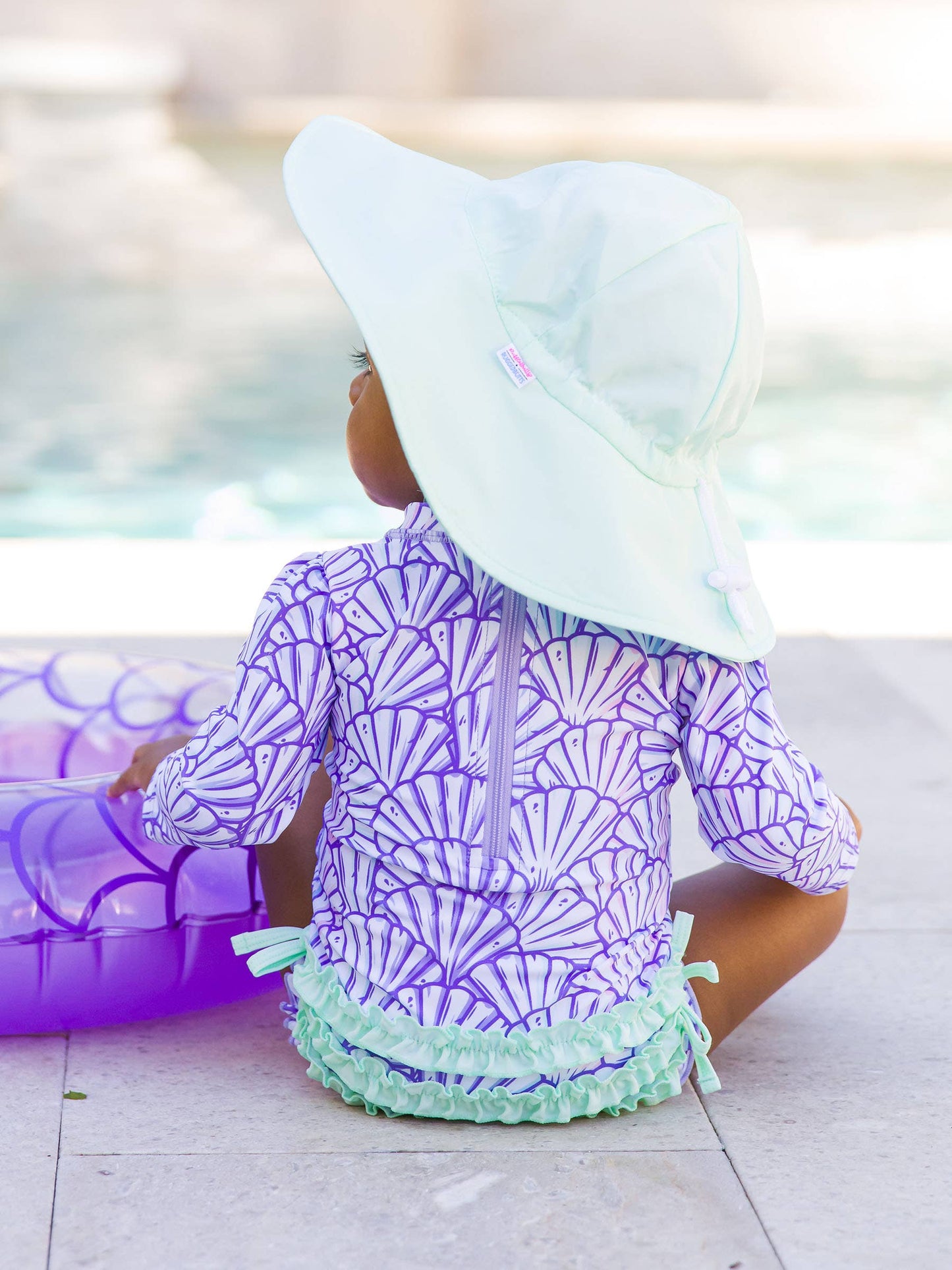 Another angle of mint UPF 50+ sun hat on baby model, side view without face, emphasizing comfortable fit