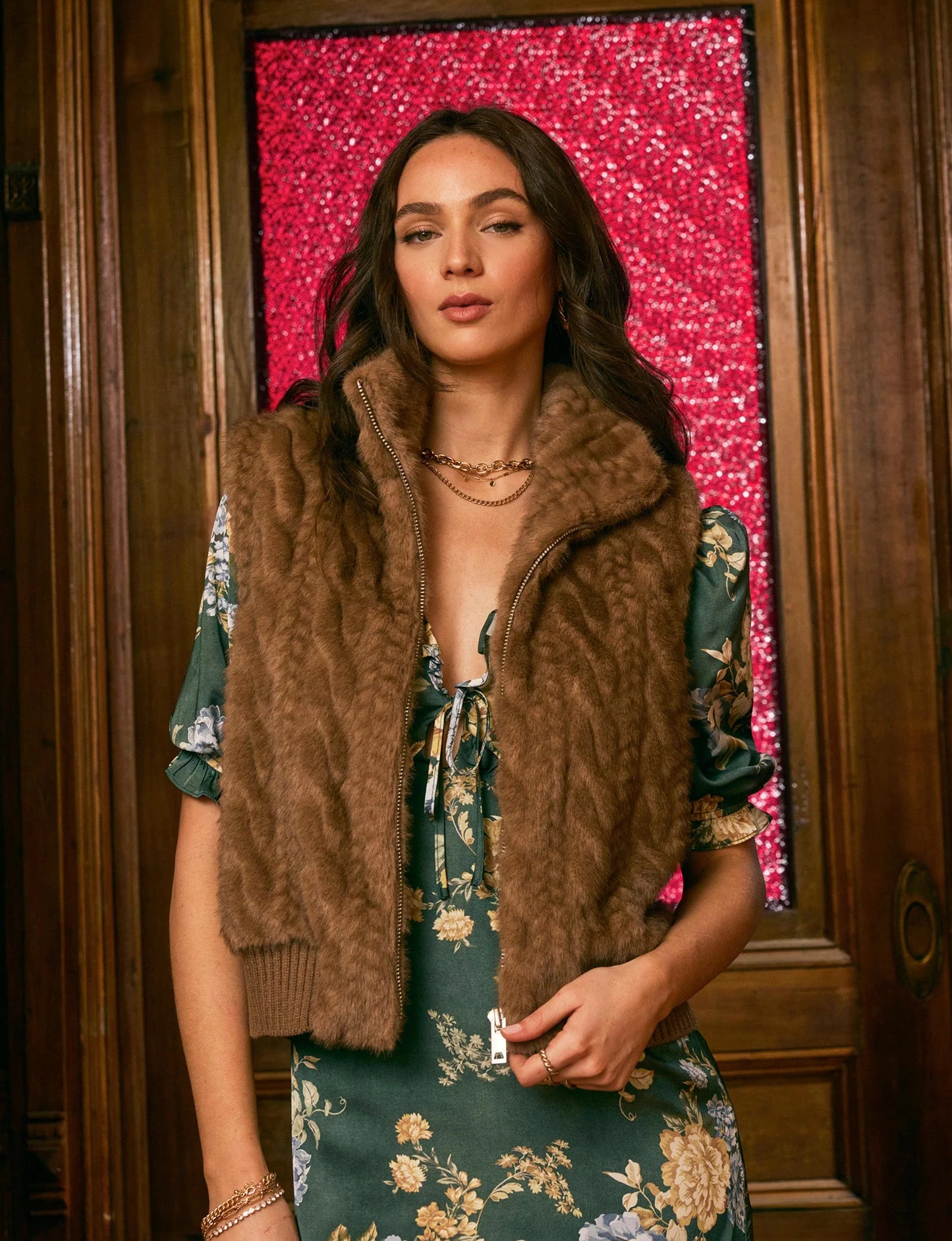 The Liana Vest layered over dress on model, demonstrating stylish versatility and cozy layering.