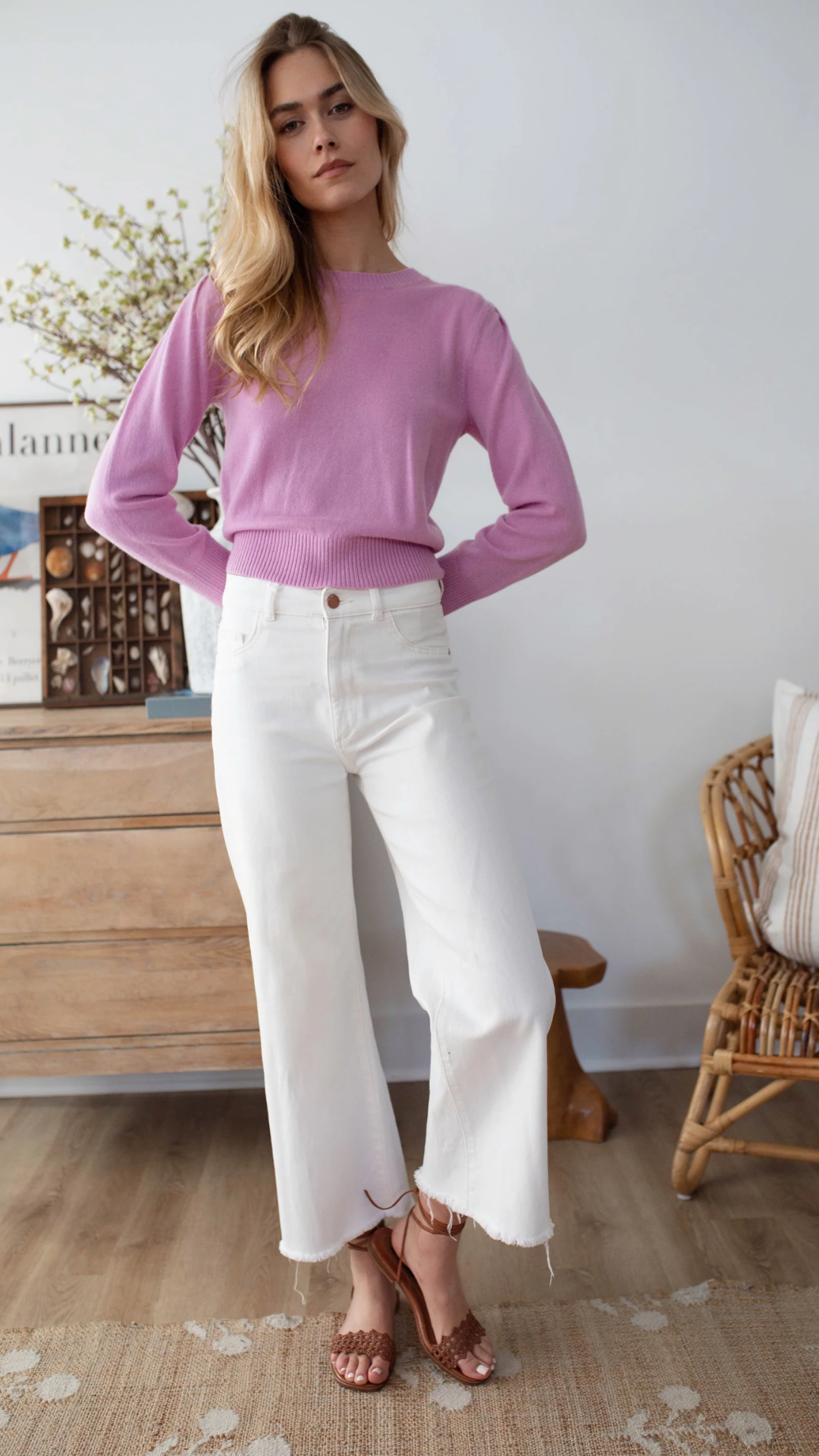 Front view of the soft cashmere crewneck sweater, elegantly draping for a refined, feminine look.