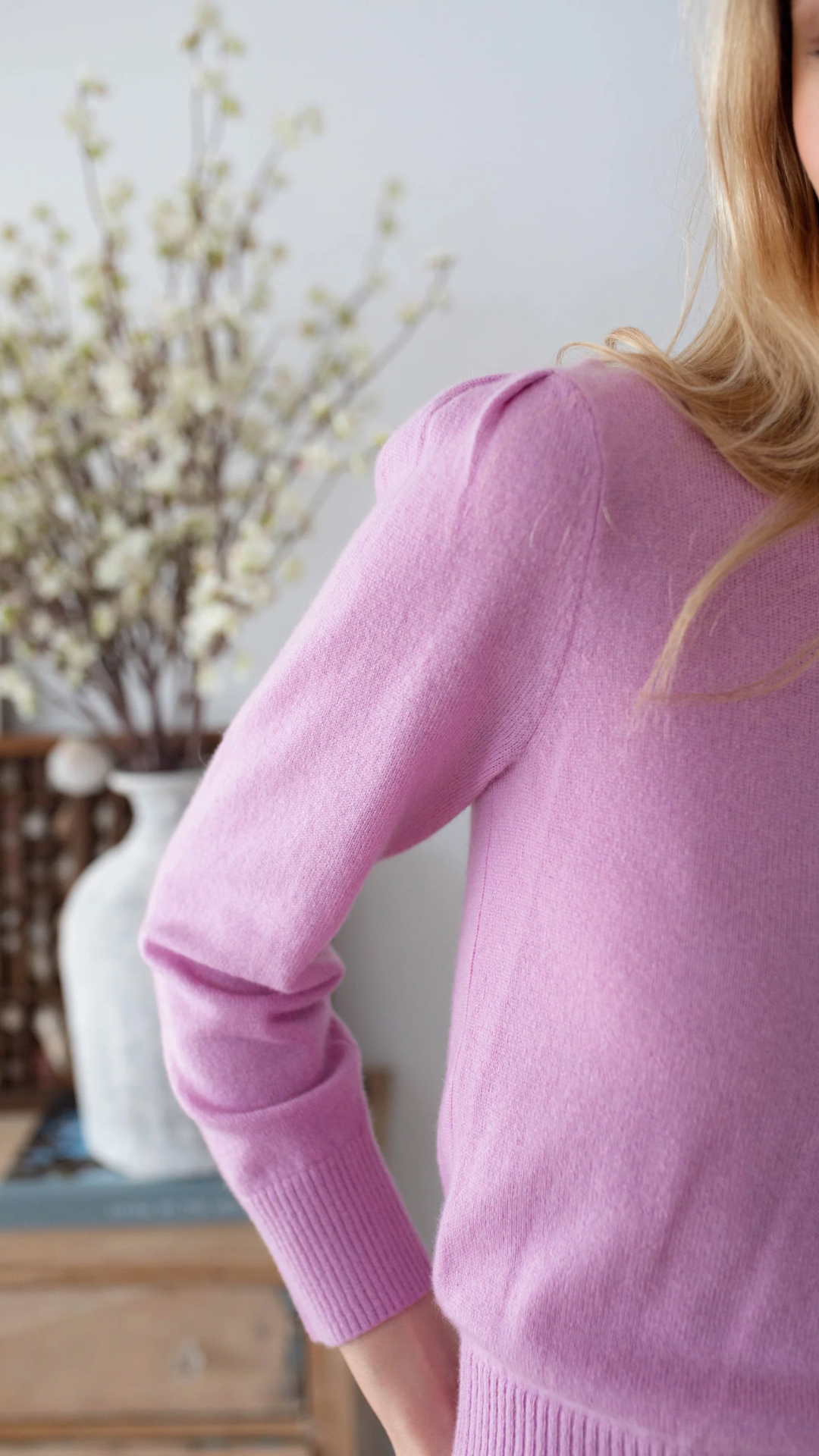 Close-up of the Marea Cashmere Sweater, highlighting the delicate puff sleeves and fine gauge knit fabric.