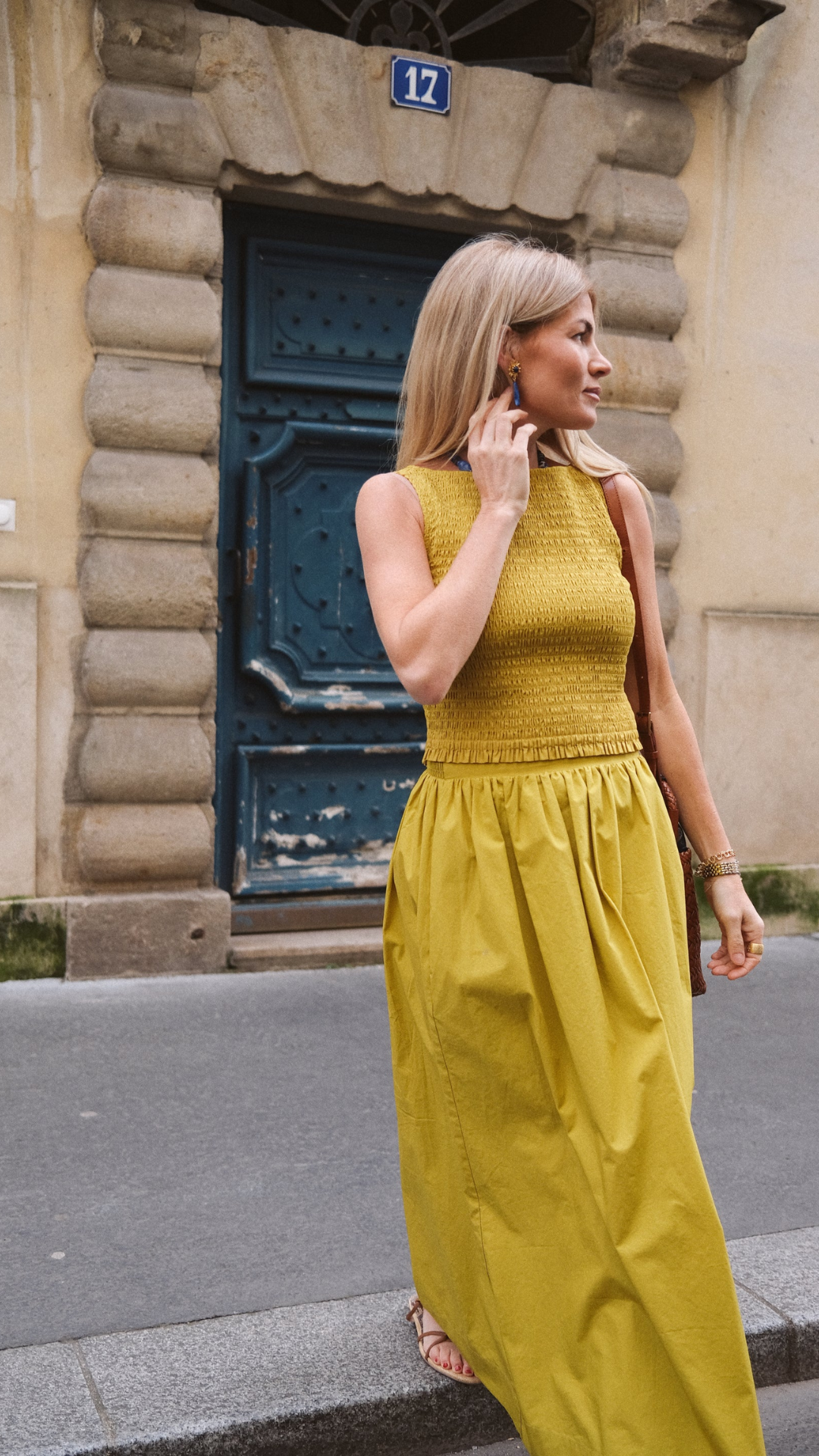 A full-body shot of the Charlotte Midi Skirt paired with a fitted top, perfect for a refined yet relaxed style.