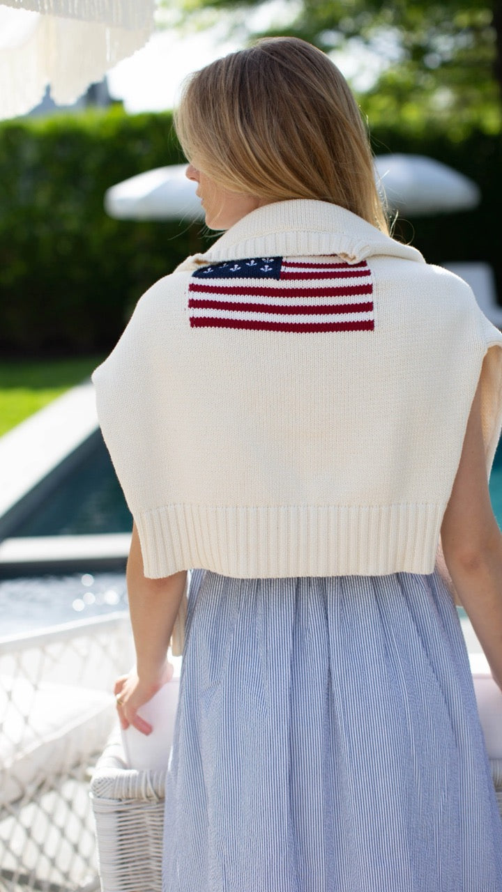 Back view of the Marea Flag Sweater in ivory layered over the Clara Pinstripe Dress—timeless and breezy.