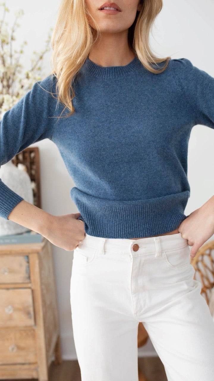 Detail of feminine puff sleeve on Marea cashmere sweater in indigo