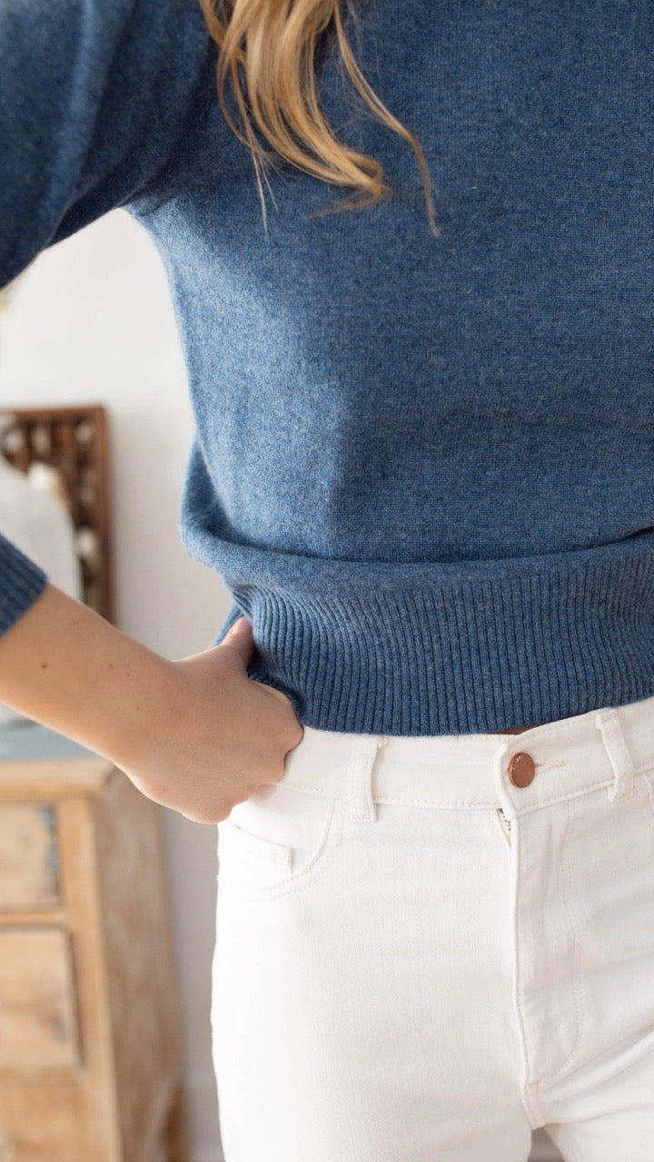 Side profile showing rib hem and sleeve shape on Marea sweater