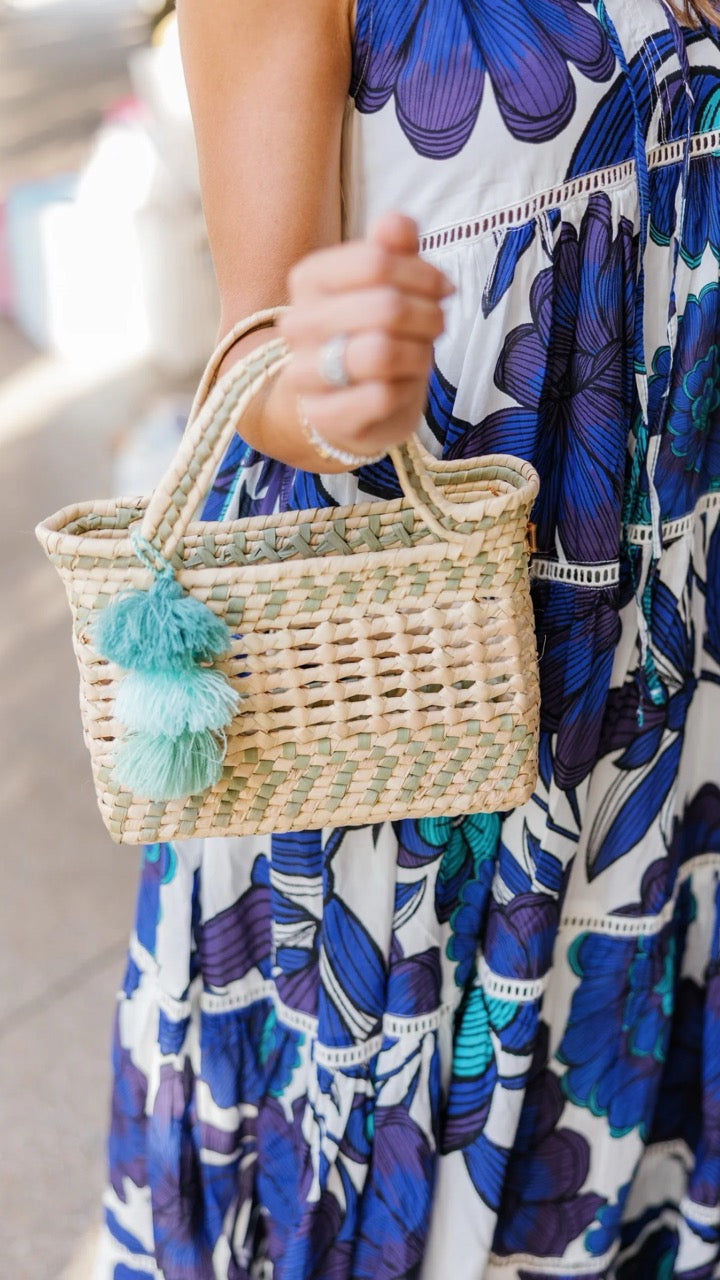 Front view of the Palm Net Yatzil Small Tote in Sage showcasing its handwoven palm leaf design.