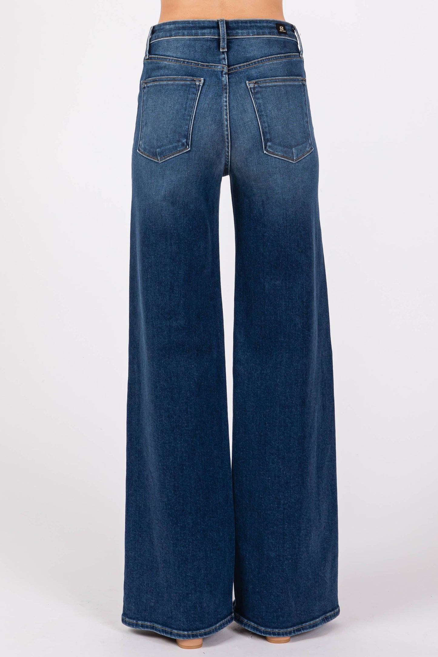 Rear view of the Pipa High Rise Superwide Jeans featuring back pocket placement, high rise waistline, and dark wash denim styling.