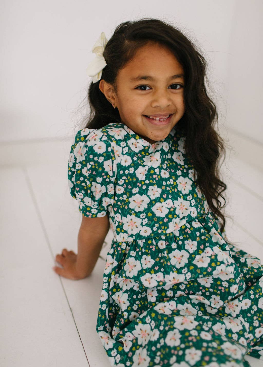 Close-up of the puff sleeve romper’s fabric and puff sleeve detail, made from soft and stretchy cotton blend.