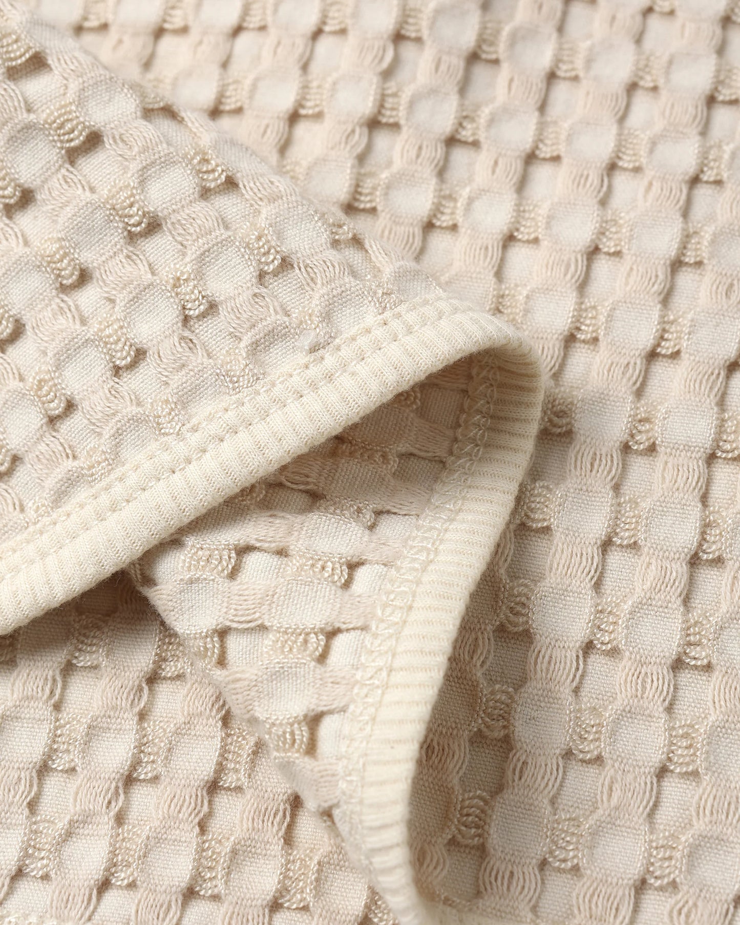 Detailed close-up of natural chunky waffle knit fabric from Quincy Mae Flynn Set, showing breathable texture and softness.
