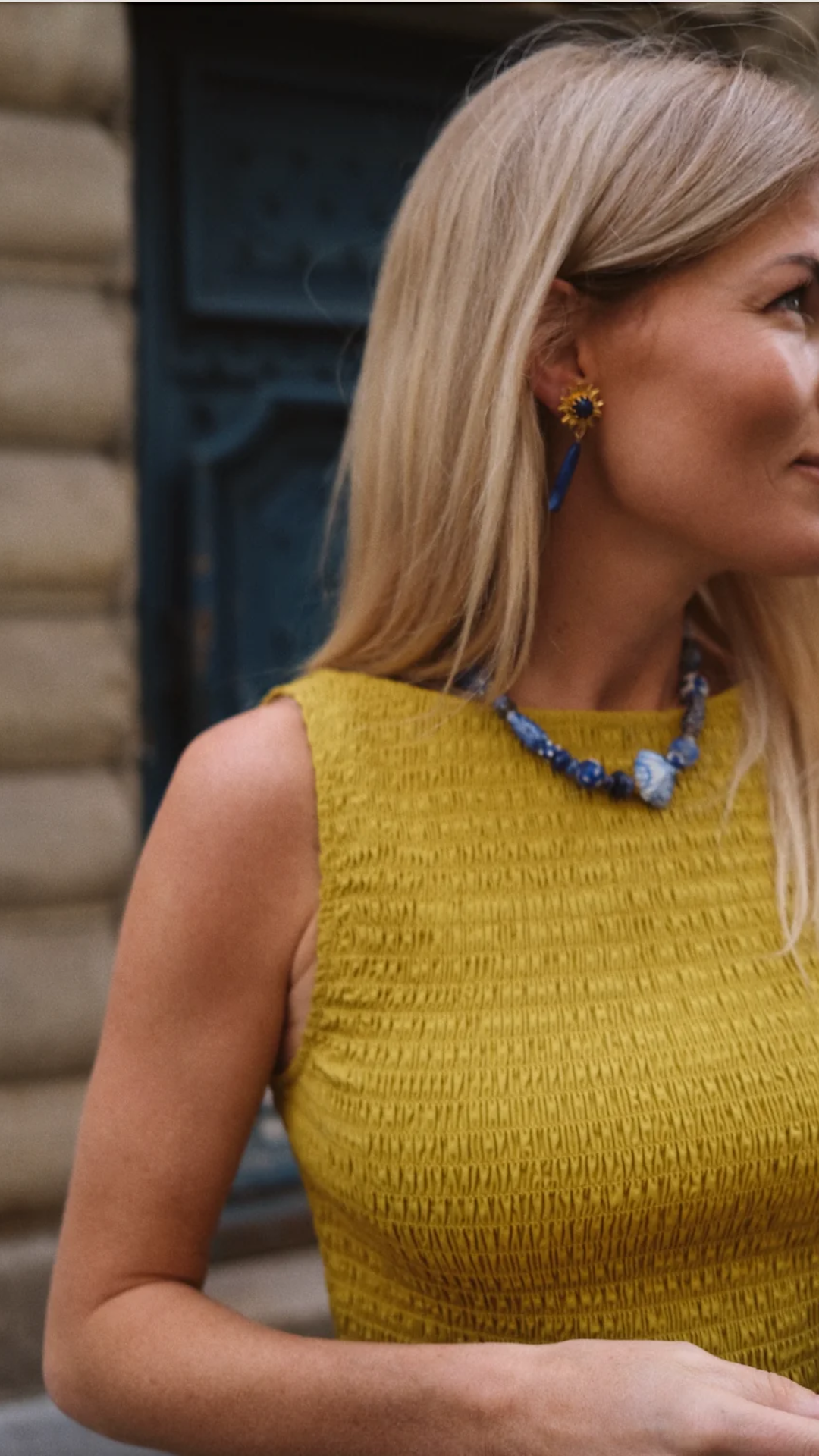 Close-up detail of the Charlotte Top’s smocked texture and boatneck cut, highlighting its refined fit.