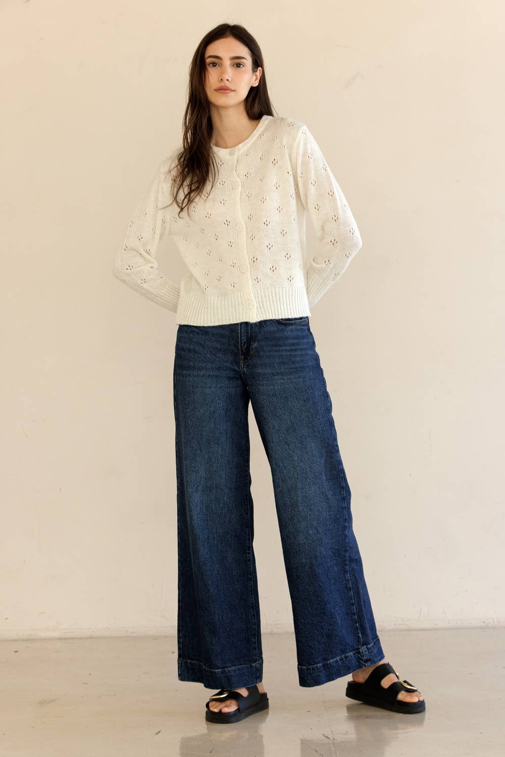 Full outfit view of model wearing Storia Ribbed Knit Button-Down Cardigan with jeans in studio