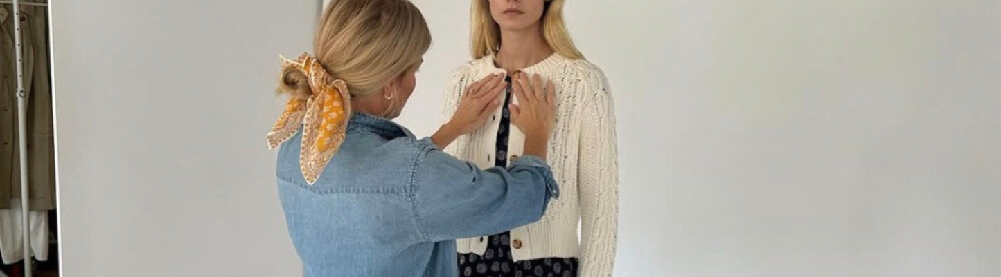 Liz Joy from Marea collaborating with a model during a photo shoot for their Fall/Winter collection, showcasing classic silhouettes and quality craftsmanship.