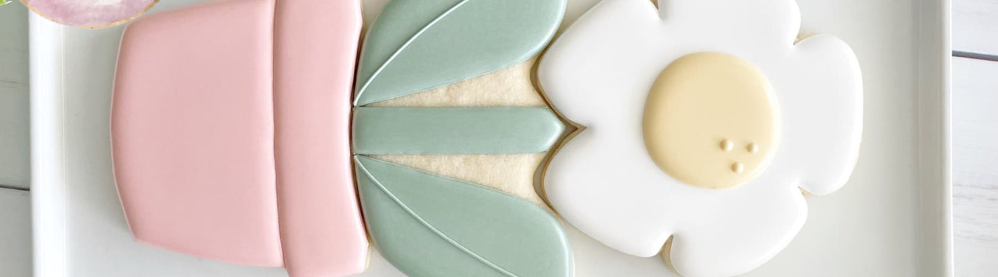Beautifully hand-decorated sugar cookies from Sweet Pea and Poppy Cookie Co, featured at their Mom and Mini cookie decorating class at Grace and Haven in Essex, CT on May 3, 2026