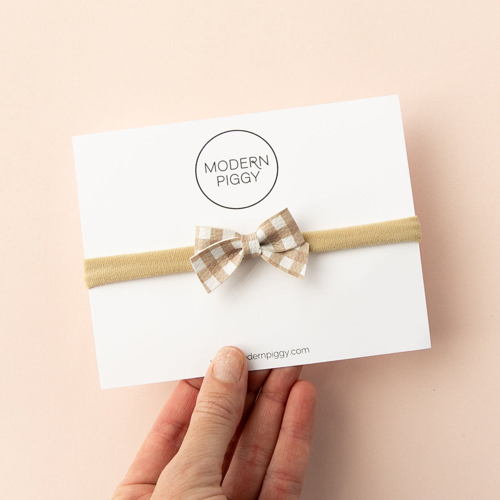 
                      
                        Mauve Gingham | Leather Baby Bow
                      
                    