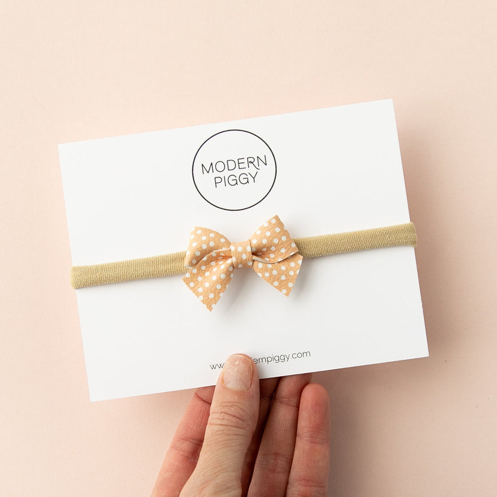 
                      
                        Peach Polka | Leather Baby Bow
                      
                    