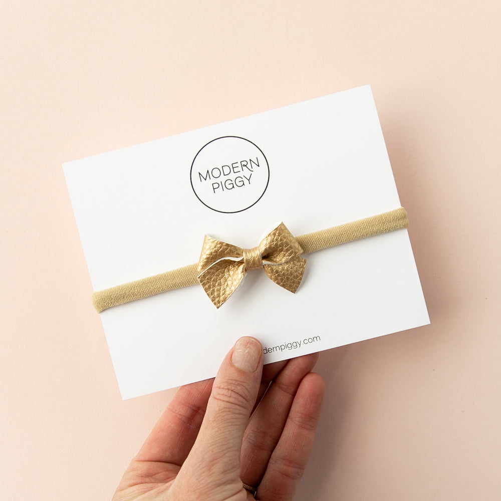 
                      
                        Gold | Leather Baby Bow
                      
                    