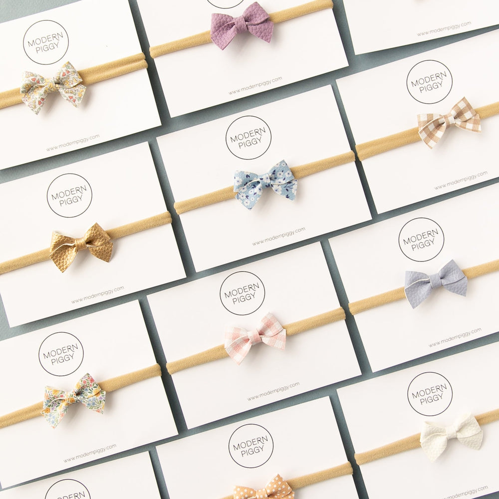 
                      
                        Petal Gingham | Leather Baby Bow
                      
                    