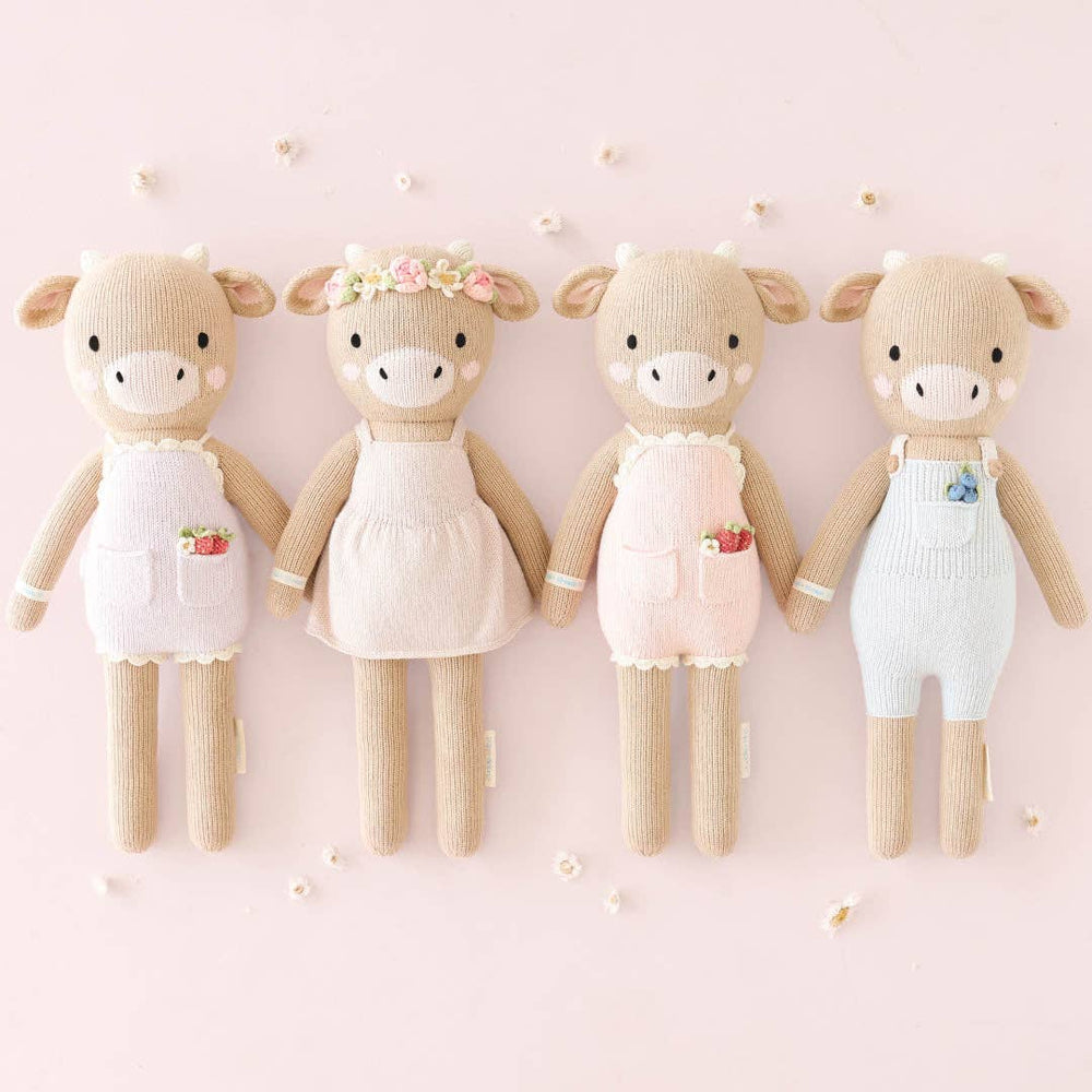 
                      
                        Asher the Cow by cuddle+kind – Hand-Knit Fair Trade Doll That Gives 10 Meals
                      
                    