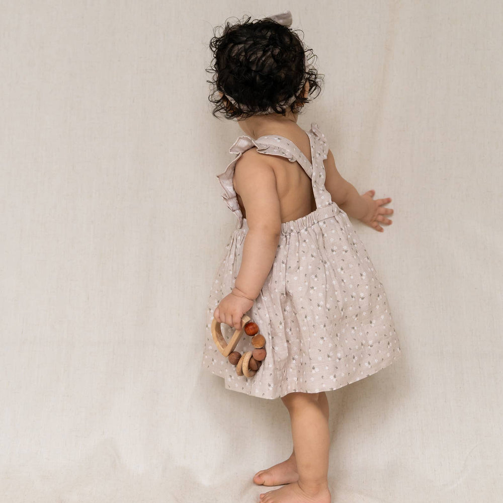 
                      
                        Ditsy Floral Ruffle Cross Back Flare Baby Dress (Organic) by Viverano Organics
                      
                    