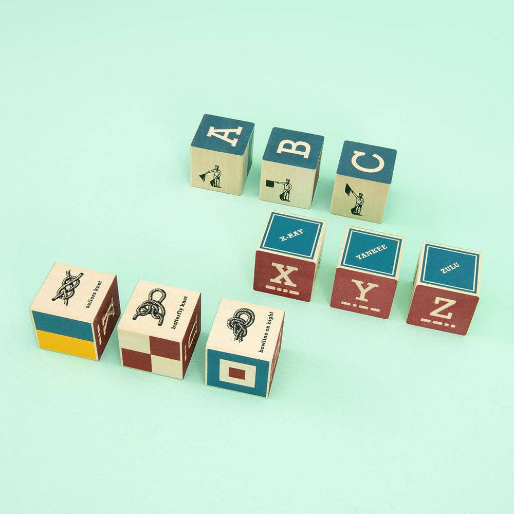 
                      
                        Uncle Goose Nautical Alphabet Blocks with Canvas Anchor Bag – Wooden Learning & Décor Set
                      
                    