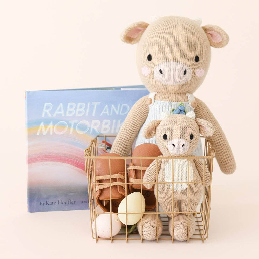 
                      
                        Asher the Cow by cuddle+kind – Hand-Knit Fair Trade Doll That Gives 10 Meals
                      
                    