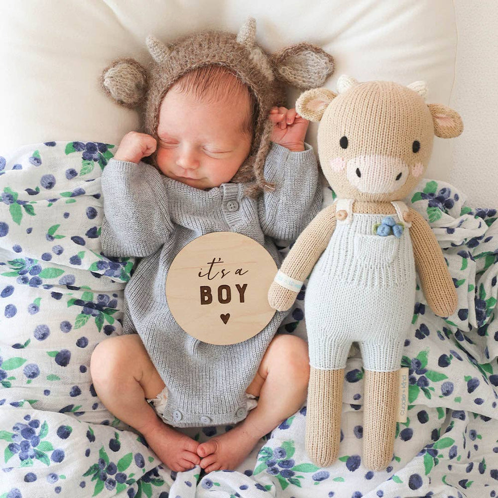 
                      
                        Asher the Cow by cuddle+kind – Hand-Knit Fair Trade Doll That Gives 10 Meals
                      
                    