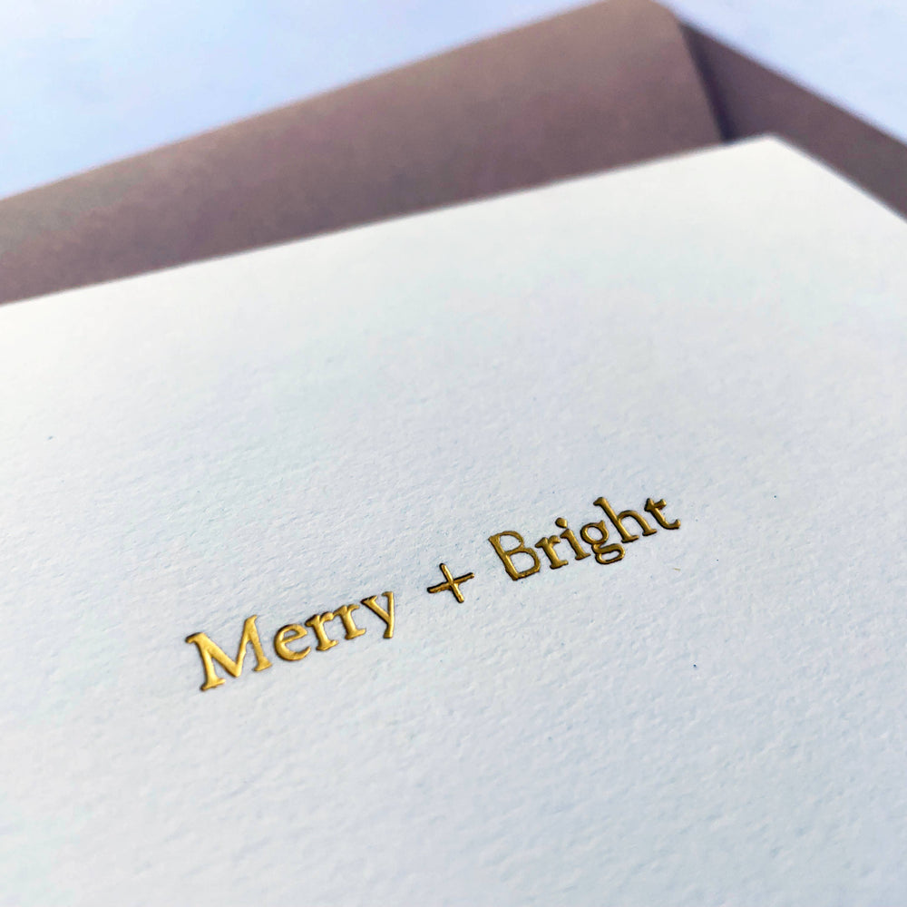 
                      
                        Merry + Bright Foil Embossed Holiday Greeting Card | Elegant A2 Ivory Christmas Card with Cream Envelope
                      
                    