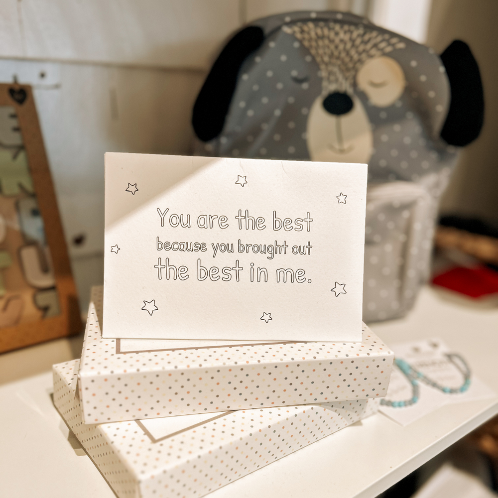 Gratitude Mail displayed alongside baby and kids’ products on a store shelf at Grace & Haven, emphasizing mindful and intentional living.