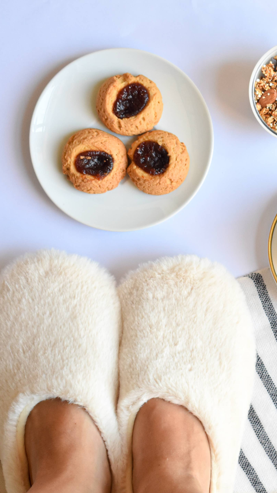 Pantuss Aromatherapy Slippers beside indulgent treats, highlighting a self-care routine with soothing lavender and flax-filled microwaveable insoles.