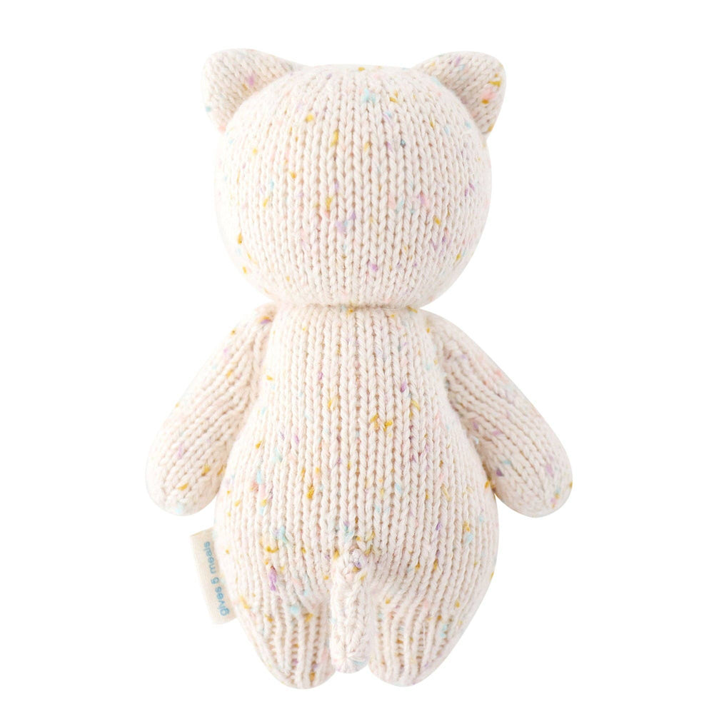 
                      
                        The back view of the Baby Kitten from Cuddle + Kind, a soft, handmade organic cotton stuffed animal. This adorable kitten features a light beige color with subtle hand-stitched details, perfect for babies and toddlers. Its sweet expression and cuddly design make it a perfect companion for children, offering comfort and joy. A high-quality, ethical toy that supports both children's happiness and the well-being of children in need.
                      
                    