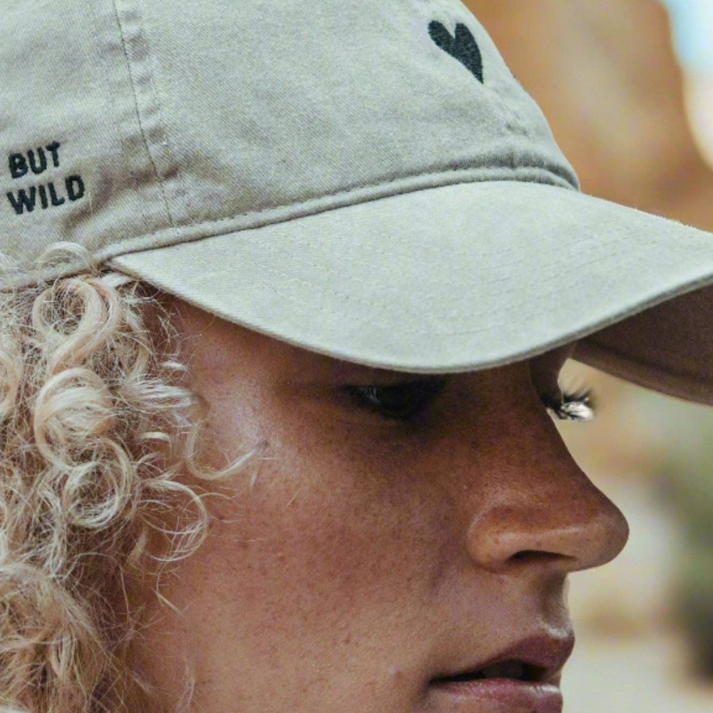 
                      
                        Model wearing the Beige Heart Hat.
                      
                    