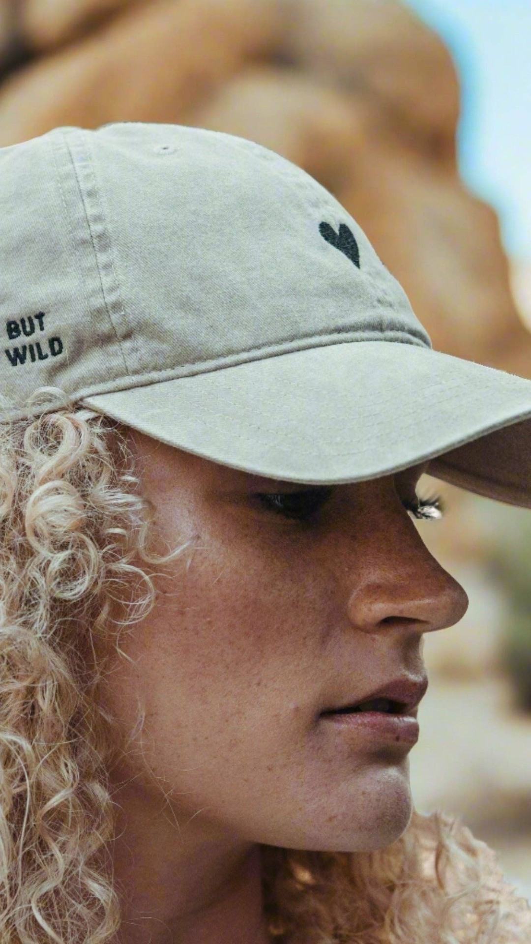 Model wearing the Beige Heart Hat.