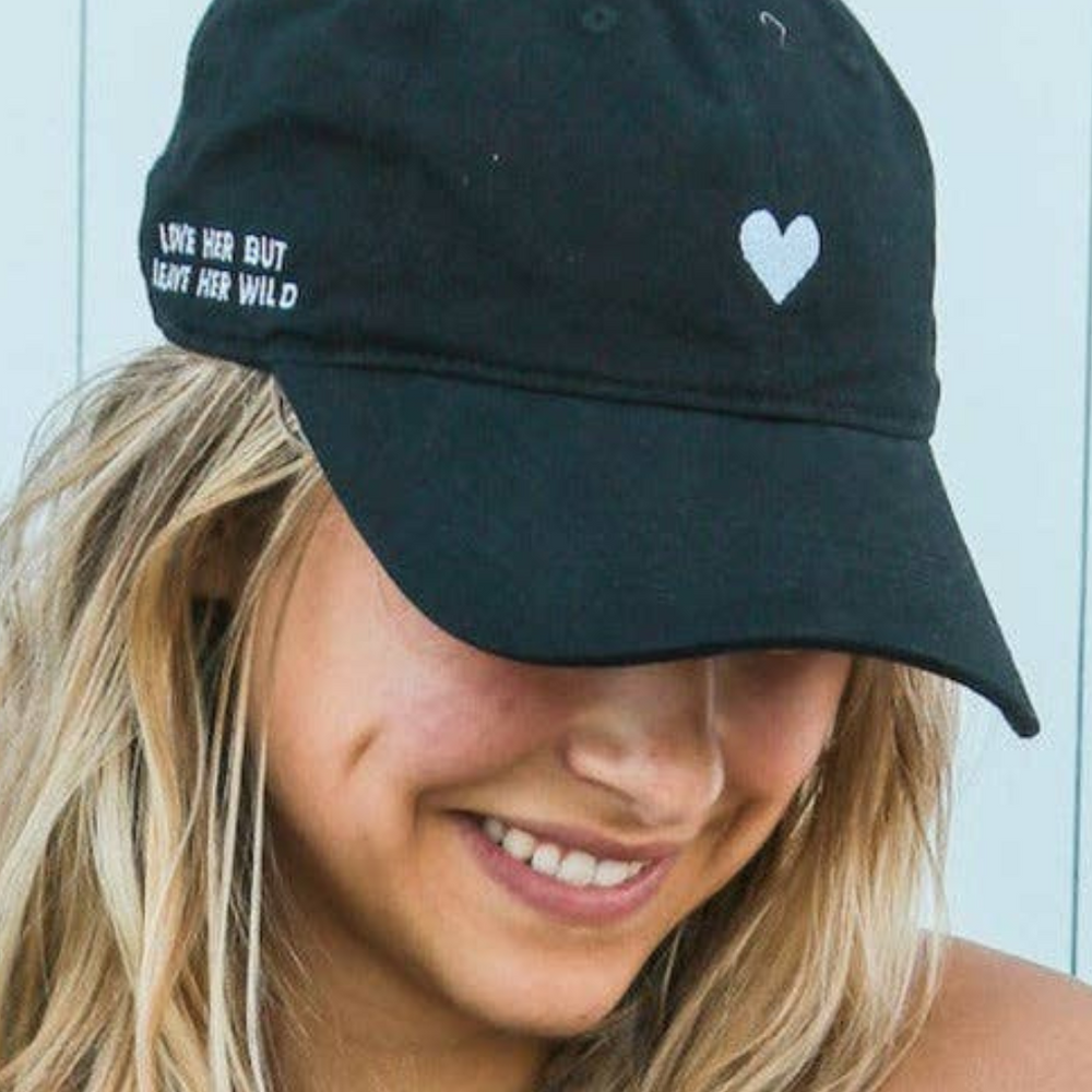 Side view of the unstructured 6-panel Black Embroidered Heart Dad Hat.